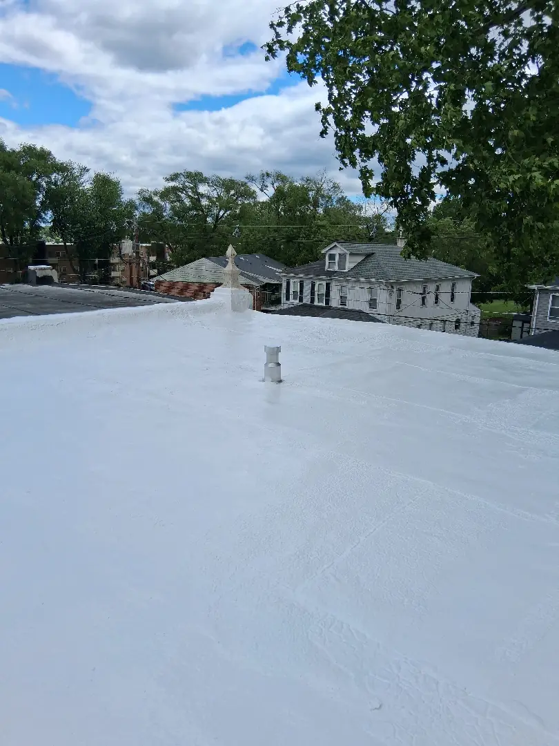 Repairing a Leaking Flat Roof with Silicone Roof Coating